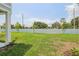 Beautiful backyard featuring green grass and a white vinyl fence at 7274 Deer Valley Cir, Tampa, FL 33635