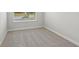 Bedroom featuring neutral carpet, window with blinds, and white walls at 7274 Deer Valley Cir, Tampa, FL 33635