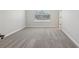 Bedroom with neutral carpet, window with blinds, and white walls at 7274 Deer Valley Cir, Tampa, FL 33635