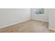 Bright bedroom with wood-look tile flooring, offering a clean, modern look at 7274 Deer Valley Cir, Tampa, FL 33635
