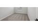 Neutral carpeted bedroom featuring gray walls, white trim, and a window with blinds at 7274 Deer Valley Cir, Tampa, FL 33635