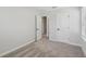 Neutral carpeted bedroom featuring gray walls, white trim, and a window with blinds at 7274 Deer Valley Cir, Tampa, FL 33635