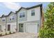 Attractive townhome with a one-car garage and well-maintained landscaping at 7274 Deer Valley Cir, Tampa, FL 33635
