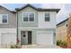 Charming townhome featuring a garage, and a neatly paved driveway leading to the entrance at 7274 Deer Valley Cir, Tampa, FL 33635