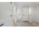 Upstairs hallway featuring carpeted floors and white doors leading to rooms and closets at 7274 Deer Valley Cir, Tampa, FL 33635