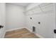 Spacious laundry room with wire shelving and tile flooring at 7274 Deer Valley Cir, Tampa, FL 33635
