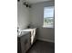 Bright bathroom showcases a double sink vanity with granite countertops and dark fixtures, offering both style and functionality at 7284 Deer Valley Cir, Tampa, FL 33635