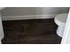 Close-up of bathroom featuring wood-look tile flooring and a white toilet at 7284 Deer Valley Cir, Tampa, FL 33635