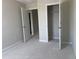 Spacious bedroom featuring multiple doorways and closet at 7284 Deer Valley Cir, Tampa, FL 33635