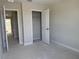 Bedroom featuring doorways and closet with open doors at 7284 Deer Valley Cir, Tampa, FL 33635