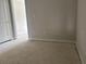 Empty bedroom with light gray carpet and white walls at 7284 Deer Valley Cir, Tampa, FL 33635