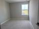 Unfurnished bedroom showcasing a window with natural light at 7284 Deer Valley Cir, Tampa, FL 33635