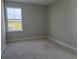 Bedroom featuring a window with a view to the outside at 7284 Deer Valley Cir, Tampa, FL 33635