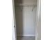An empty, open closet features a top shelf with white rod at 7284 Deer Valley Cir, Tampa, FL 33635