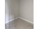 Empty walk-in closet features neutral walls and trim, offering a blank canvas for personalized storage solutions at 7284 Deer Valley Cir, Tampa, FL 33635