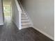 Open entryway with dark-tiled flooring and stairway at 7284 Deer Valley Cir, Tampa, FL 33635