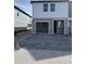Modern two-story townhome featuring an attached garage and a neatly paved driveway at 7284 Deer Valley Cir, Tampa, FL 33635