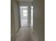 Hallway offering seamless transitions between rooms, finished in neutral tones for a modern aesthetic at 7284 Deer Valley Cir, Tampa, FL 33635