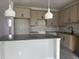 Modern kitchen featuring gray cabinets, gray subway tile backsplash, gray countertop and stainless steel appliances at 7284 Deer Valley Cir, Tampa, FL 33635