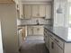 Modern kitchen featuring shaker cabinets, granite countertops, and stainless steel appliances at 7284 Deer Valley Cir, Tampa, FL 33635