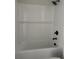 Clean, white tiled shower and tub combo at 7284 Deer Valley Cir, Tampa, FL 33635