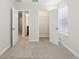 Bedroom showcasing a closet and bathroom, both with open doors and neutral walls at 7294 Deer Valley Cir, Tampa, FL 33635