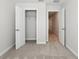 Bedroom showcasing a closet with open doors and neutral walls at 7294 Deer Valley Cir, Tampa, FL 33635