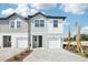 Charming two-story townhome featuring a one car garage and beautifully paved driveway at 7294 Deer Valley Cir, Tampa, FL 33635