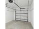 A clean garage featuring a concrete floor and a sectional garage door at 7294 Deer Valley Cir, Tampa, FL 33635