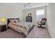 Bright bedroom with a bed, dresser, and chair, perfect for relaxation and comfort at 10607 Standing Stone Drive, Wimauma, FL 33598