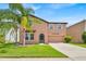 Charming two-story home with well-maintained lawn and inviting front entrance at 10607 Standing Stone Drive, Wimauma, FL 33598