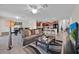 Spacious living room seamlessly connected to an open kitchen, perfect for modern living at 10607 Standing Stone Drive, Wimauma, FL 33598