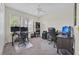 Bright office space with two workstations, neutral walls, and a ceiling fan for added comfort at 10607 Standing Stone Drive, Wimauma, FL 33598