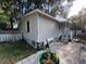 Charming single-story home with vinyl siding and a cozy front porch, offering classic curb appeal at 12485 Land St, Largo, FL 33773