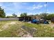 Expansive backyard featuring a screened-in porch, with ample space for outdoor activities at 215 Melody Ln, Largo, FL 33771