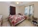 Bright bedroom with tile flooring, natural light, and simple furnishings at 215 Melody Ln, Largo, FL 33771