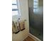 Close up of a tiled walk-in shower and patterned towel in a home bathroom at 9790 66Th N St # 238, Pinellas Park, FL 33782