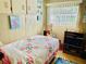 The cozy bedroom features cheerful decor and comfortable furnishings at 9790 66Th N St # 238, Pinellas Park, FL 33782