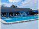 Community pool area with ample seating and a well-maintained swimming area for residents at 9790 66Th N St # 238, Pinellas Park, FL 33782