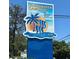 Entrance sign for Clearwater Cascade, a 55+ resident-owned community, with a tropical design at 9790 66Th N St # 238, Pinellas Park, FL 33782