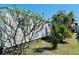 Exterior of the home featuring the home's white siding and attractive landscaping around the property at 9790 66Th N St # 238, Pinellas Park, FL 33782