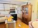 Functional kitchen featuring an electric range, ample cabinetry, and a wooden hutch at 9790 66Th N St # 238, Pinellas Park, FL 33782