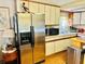 Bright kitchen with white cabinetry, stainless steel refrigerator, and modern appliances at 9790 66Th N St # 238, Pinellas Park, FL 33782