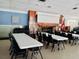Meeting room with tables and chairs and decorative fireplace at 9790 66Th N St # 238, Pinellas Park, FL 33782