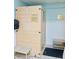Enclosed wooden sauna with glass door and bench seating inside, adjacent to shower and additional seating in the room at 9790 66Th N St # 238, Pinellas Park, FL 33782