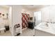 Well-lit bathroom with double sinks, granite countertops, a tiled floor, and a shower with a decorative curtain at 3715 Capri Coast, Plant City, FL 33565