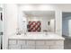 Bathroom featuring double sinks, a large mirror, and a bathtub, perfect for a Gathering at 3715 Capri Coast, Plant City, FL 33565