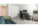 Bedroom with a desk, large window, carpeted floor, and neutral paint, ideal for work or relaxation at 3715 Capri Coast, Plant City, FL 33565