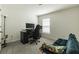 Cozy bedroom featuring a desk, comfortable chair and a large window, perfect for a home office at 3715 Capri Coast, Plant City, FL 33565