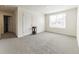 Bedroom featuring carpet flooring and a large window, creating a comfortable and inviting space at 3715 Capri Coast, Plant City, FL 33565